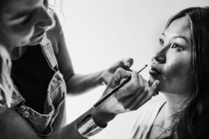 Bride getting hair and makeup